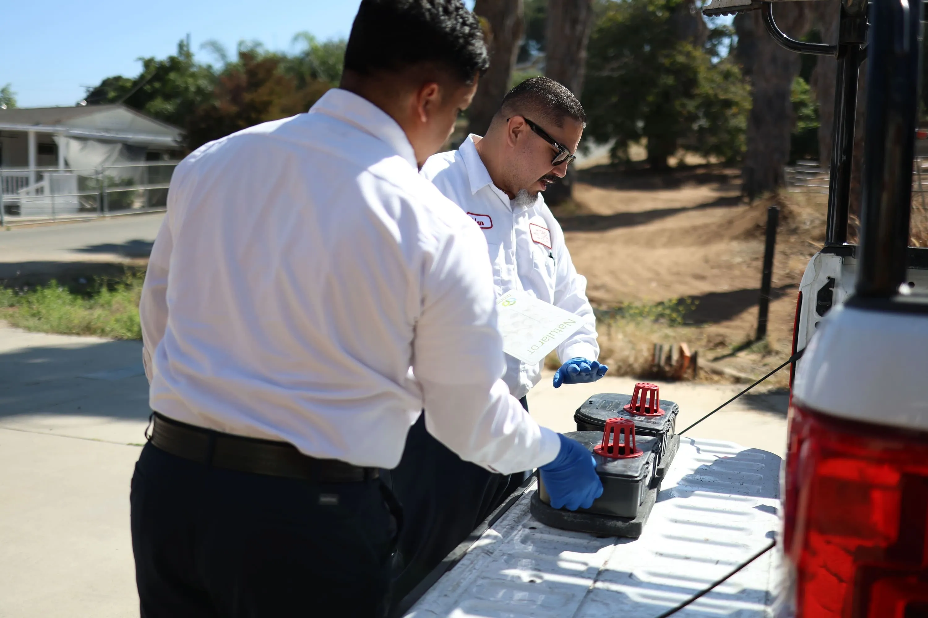 Hydrex Pest Control San Diego technicians installing rodent bait stations