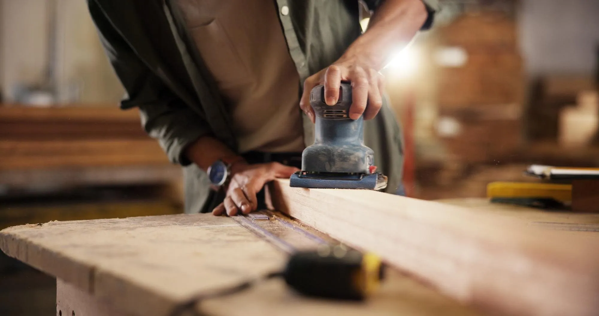 Carpenter repairing wood damaged by termites for Hydrex Pest Control San Diego